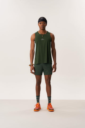 Model wearing breathable ERA CAP PRO Gore-Tex hat and green LAGO lightweight shorts designed for anti-chafing and outdoor activity