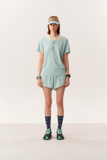 Model wearing TANITH moisture wicking short sleeve t-shirt and LAGO quick-dry seamless running shorts in studio lighting