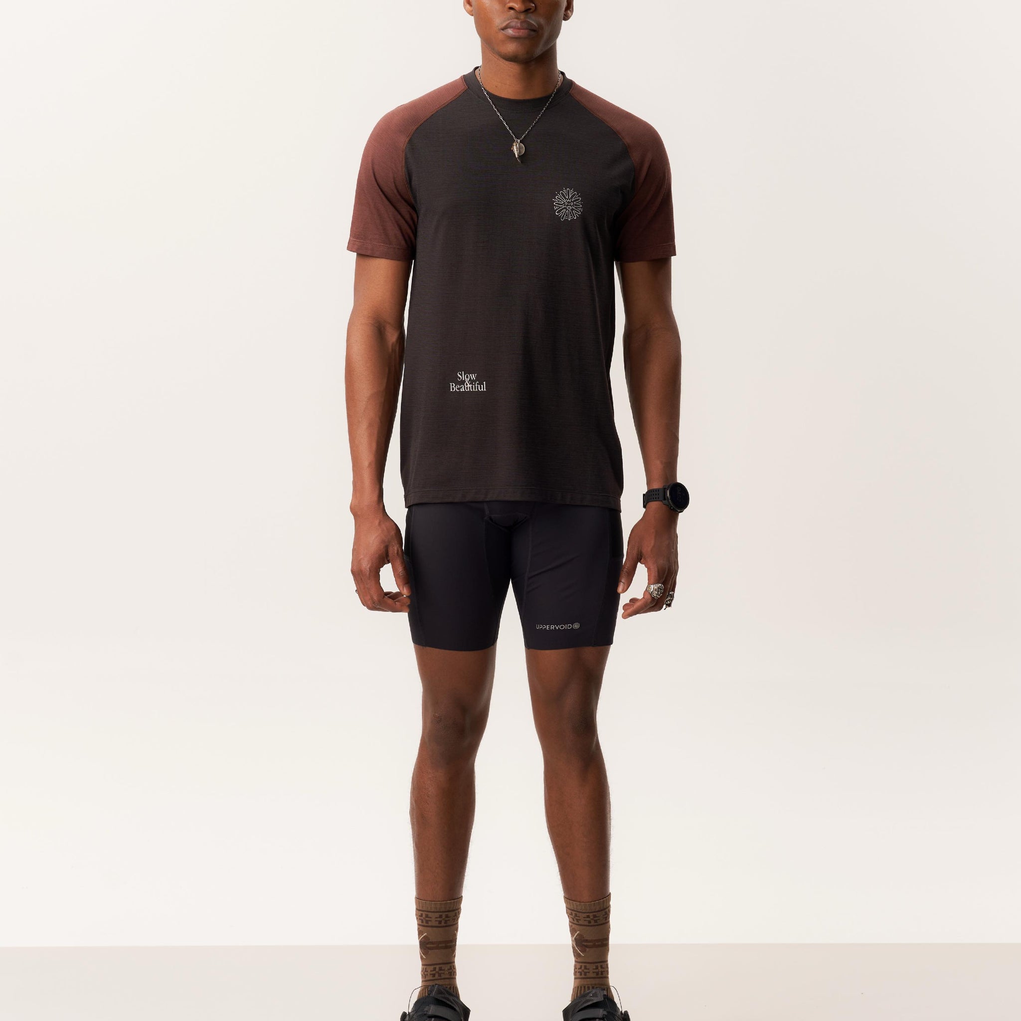 Model wearing MAAT merino wool short sleeve T-shirt and OTHELLO 9 inch compression seamless shorts
