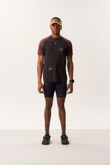Model wearing MAAT merino wool short sleeve T-shirt and OTHELLO 9 inch compression seamless shorts